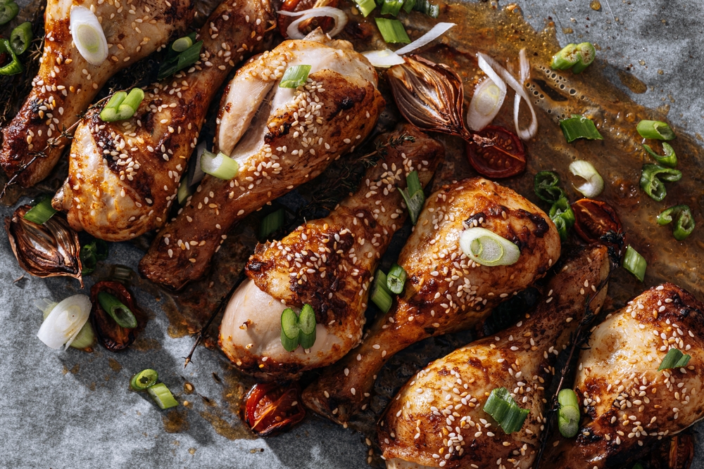 Roasted chicken on platter with green onions