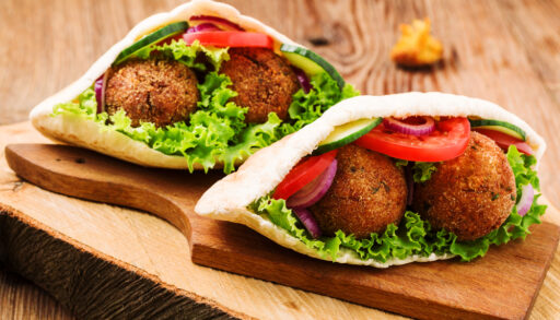 Falafel in pita on cutting board