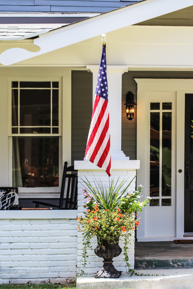 American flag hanging off cottage