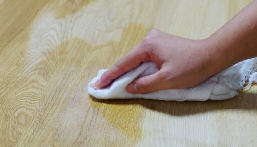 Hand wiping wood with solution