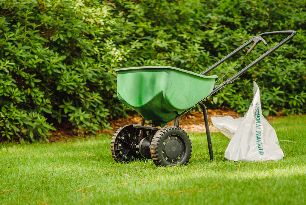 manual walker grass fertilizer on lawn