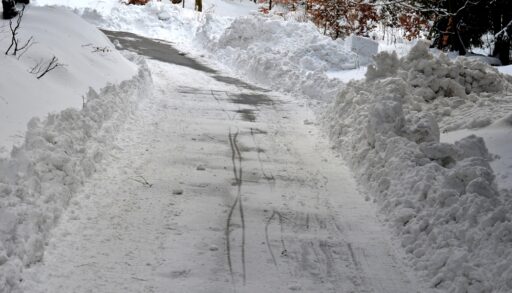 Snowy road in forest