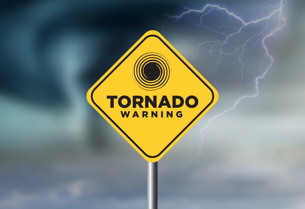 Tornado with warning sign