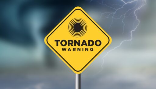 Tornado with warning sign