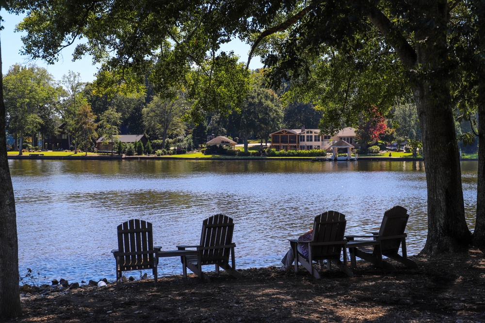 Four lawn chairs on beach