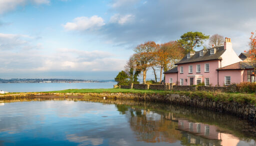 Pink cottage and shoreline