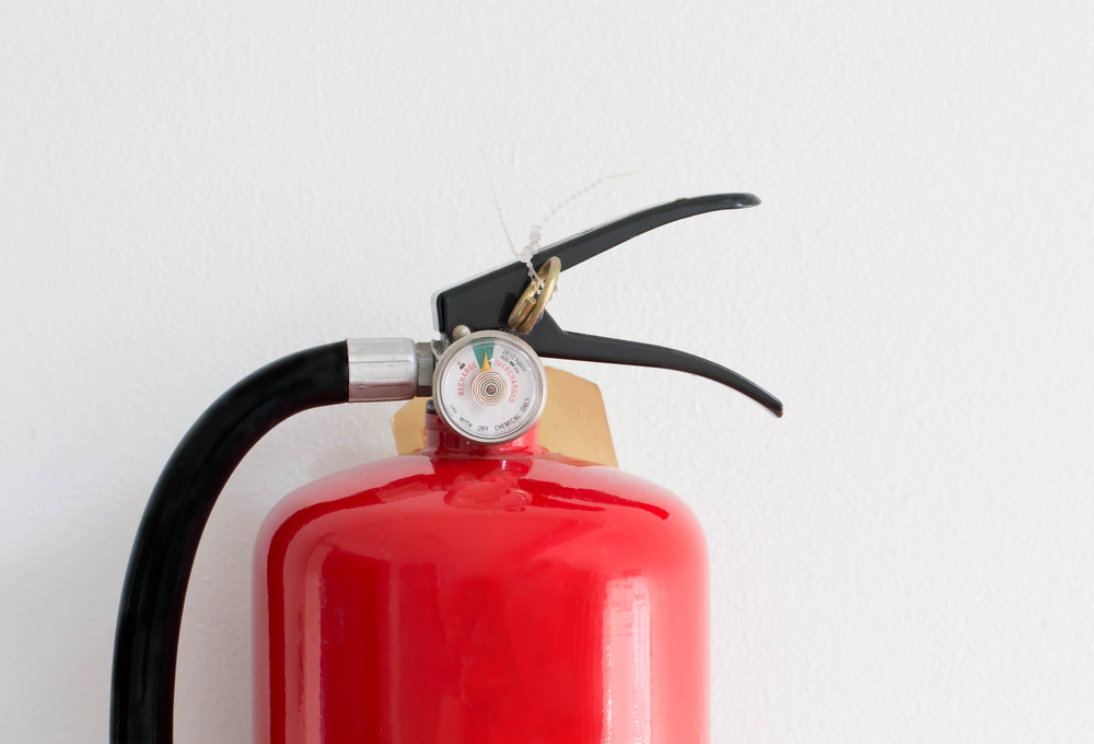Close-up of fire extinguisher gauges.