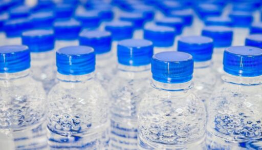 Close-up of the blue lids of bottled water.