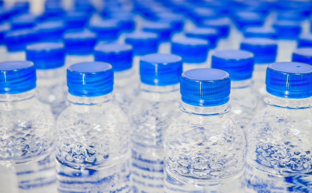 Close-up of the blue lids of bottled water.