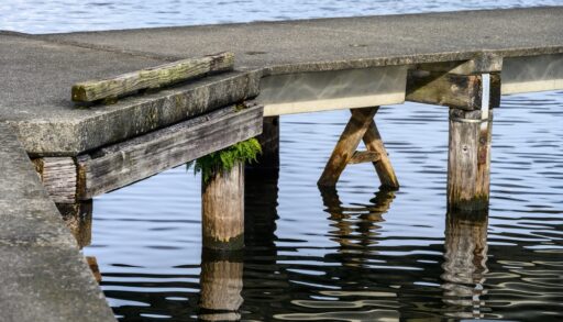 Side view of a concrete dock on a lake.