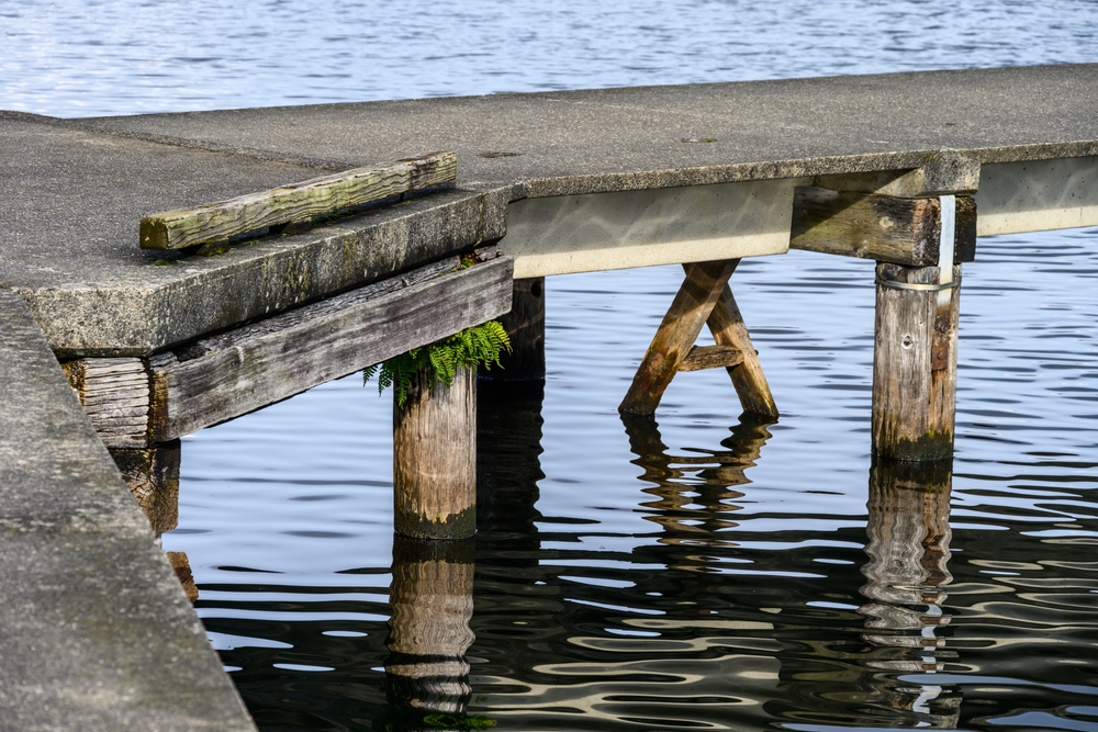 Side view of a concrete dock on a lake.