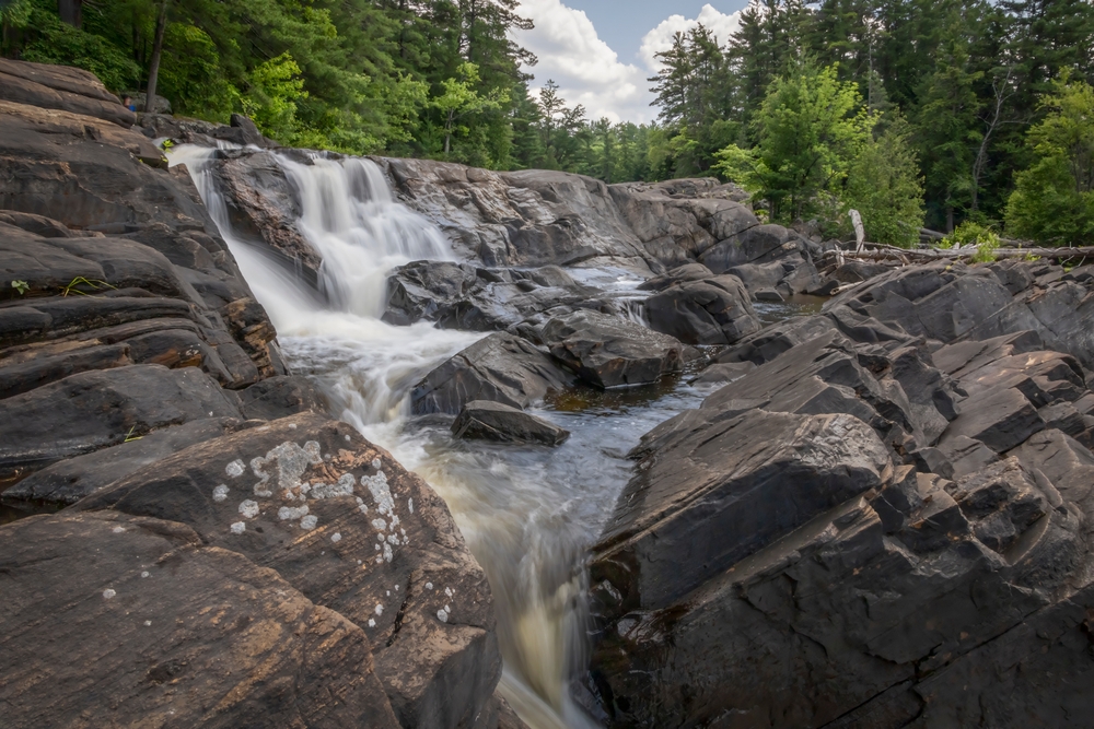 Side view of Wilson's Falls, Ontario on a cloudy day.