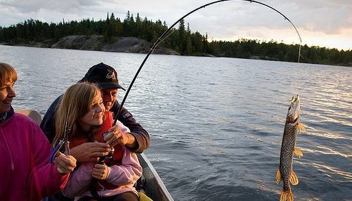 People fishing from boat