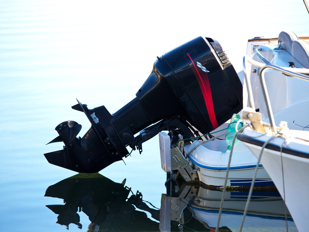 Close-up of a black outboard boat engine.