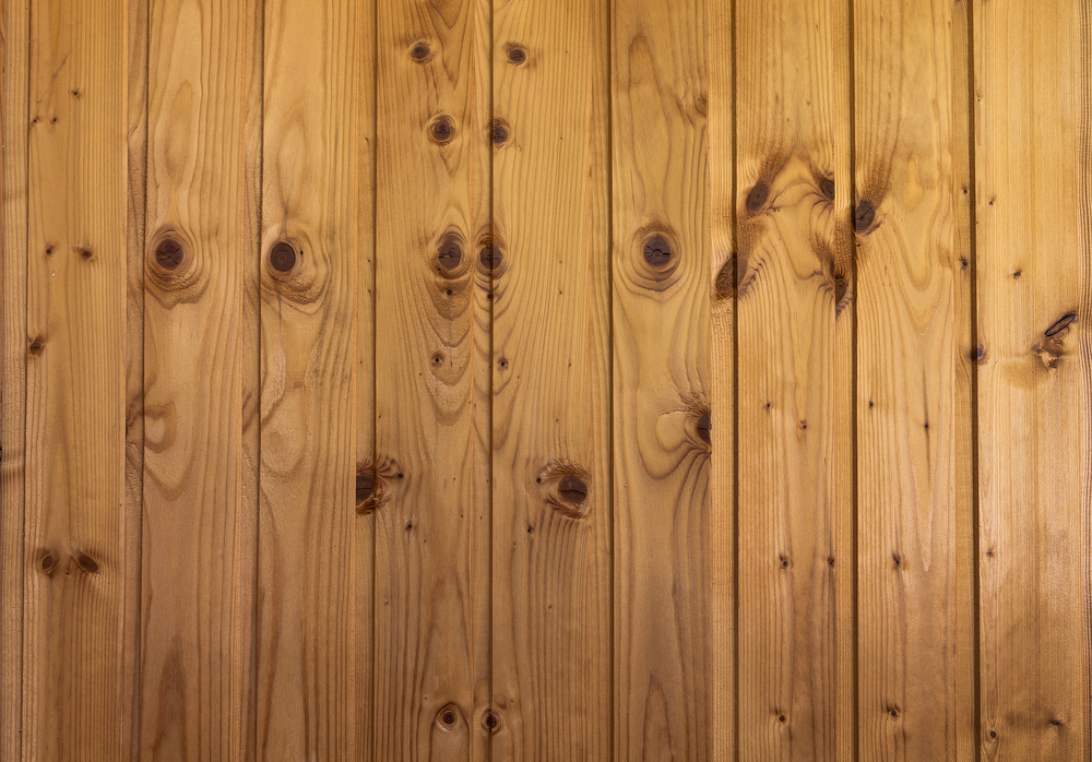 Close-up of pine flooring running vertically.