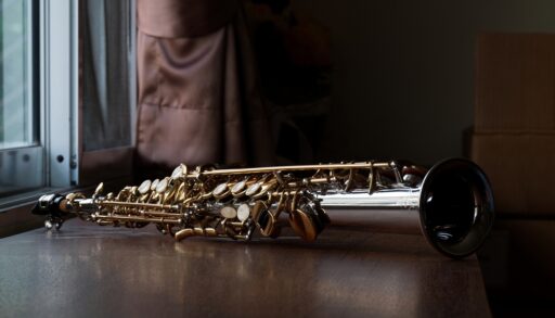 Close-up of a soprano saxophone on a table.