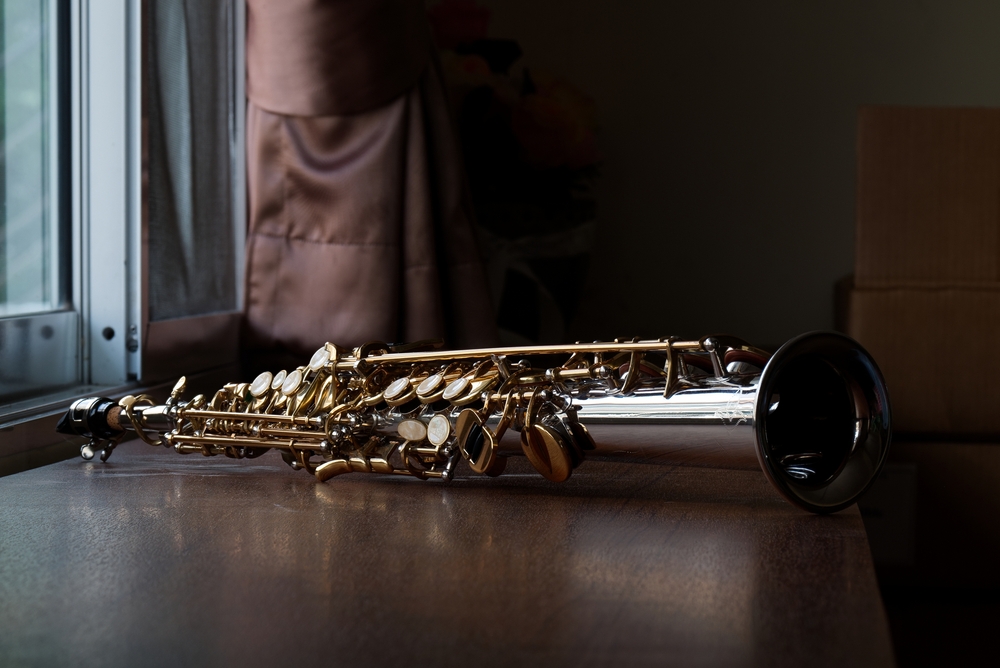 Close-up of a soprano saxophone on a table.