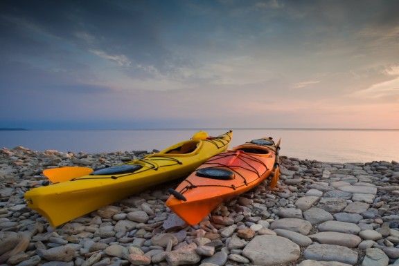 Kayaks on rocky shore