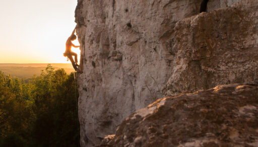 Silhouette of a woman climbing the Niagara Escarpment.