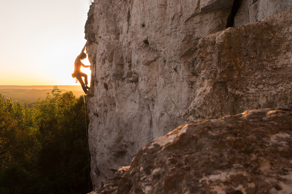 Silhouette of a woman climbing the Niagara Escarpment.