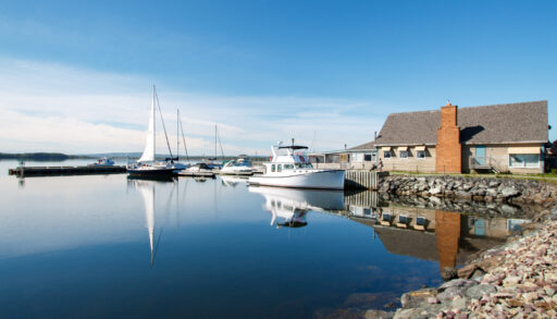 Harbour with a white boat in Pictou, Nova Scotia.