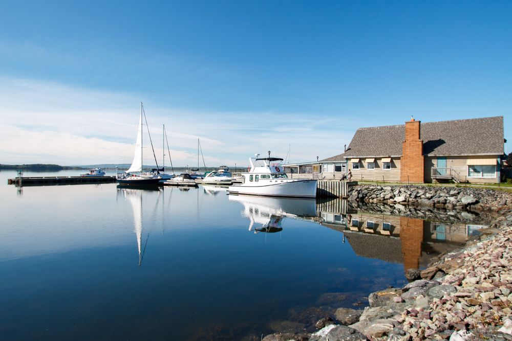 Harbour with a white boat in Pictou, Nova Scotia.