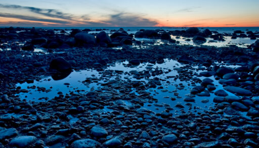 Rocky beach in Georgian Bay, Ontario at sunset.