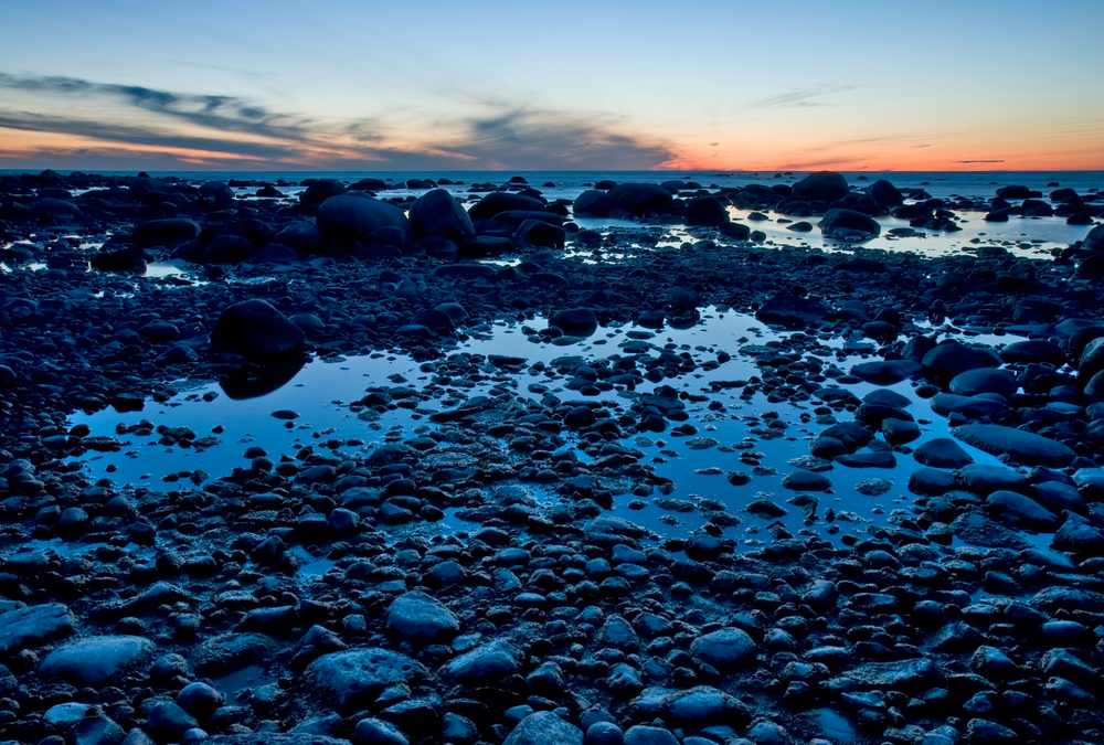 Rocky beach in Georgian Bay, Ontario at sunset.
