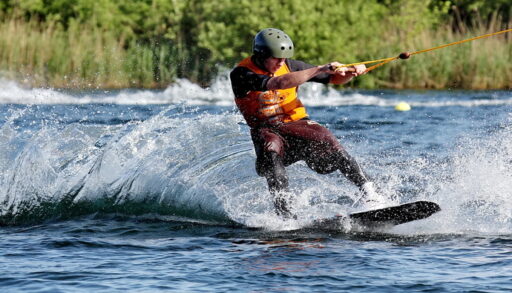 Man wakeboarding on a lake.