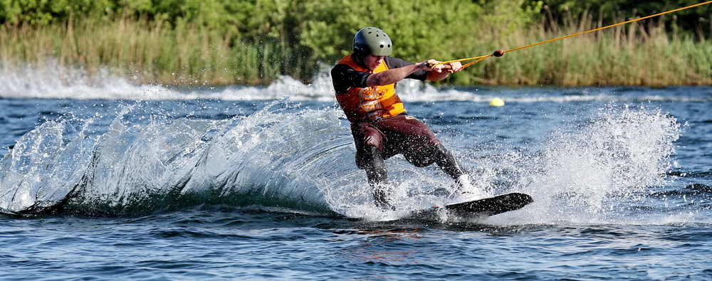 Man wakeboarding on a lake.