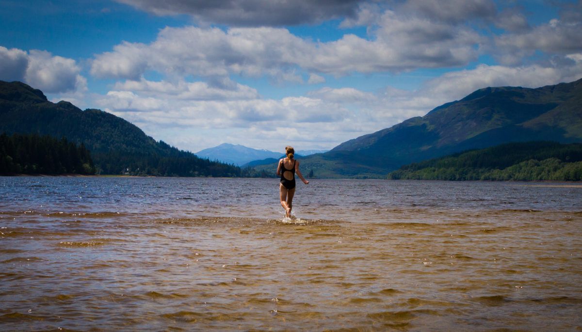 woman-walking-into-lake