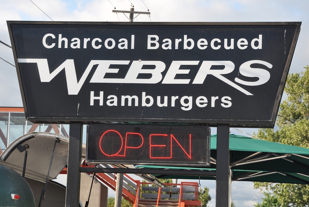 Black sign for Webers Restaurant in Orilla, Ontario.