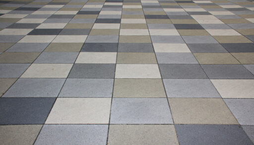 Different grey-coloured pavement tiles.