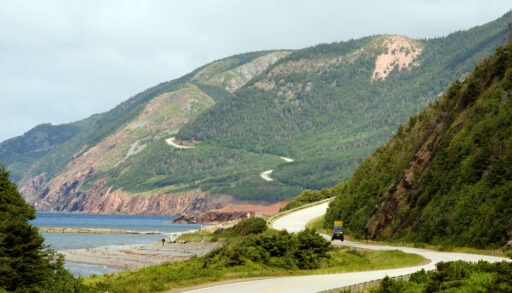 Winding road along the hills of Cape Breton Highlands National Park in Nova Scotia.