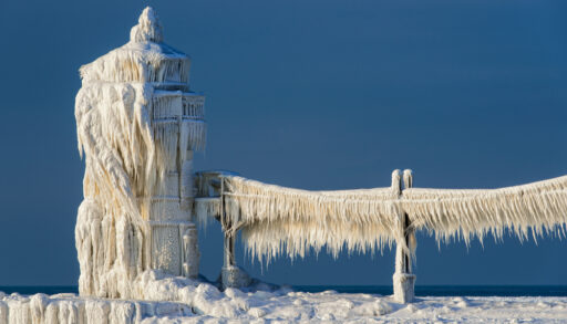 St. Joseph North Pier, Lake Michigan lighthouse covered in snow and ice.