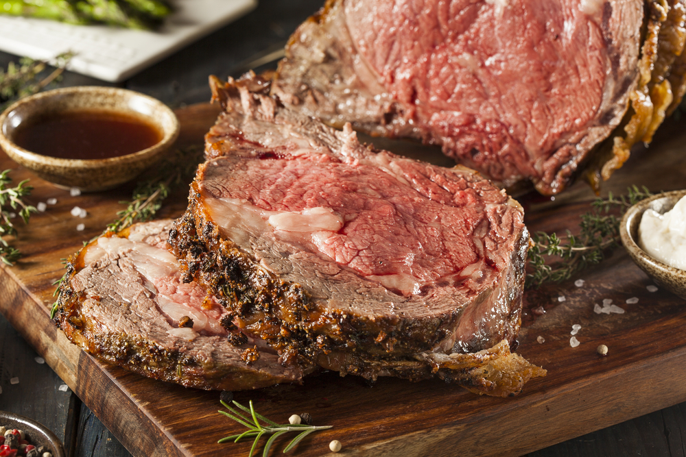 Close-up of a sliced, cooked prime rib roast.