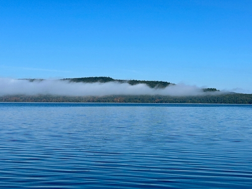 Fog over the Ottawa River, hiding the Quebec Mountains, Quebec, Canada.