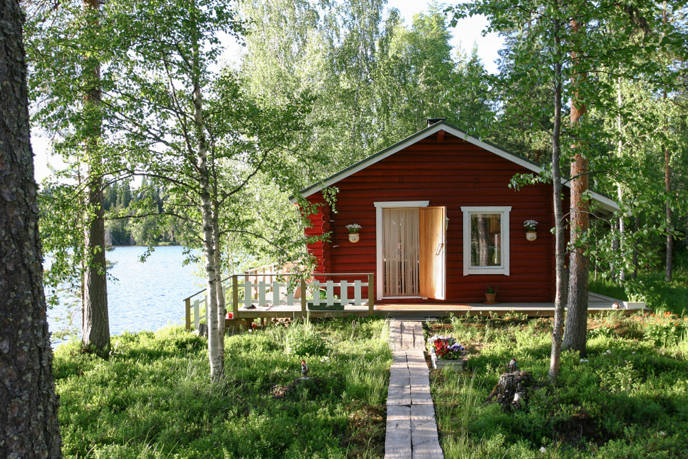 Red cabin along a lake in Finland.