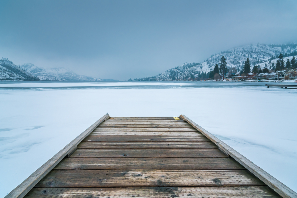 dock in frozen lake in winter