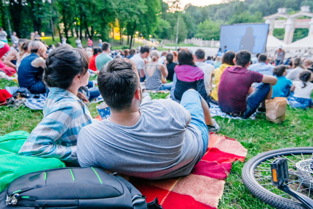 People watching an outdoor performance.