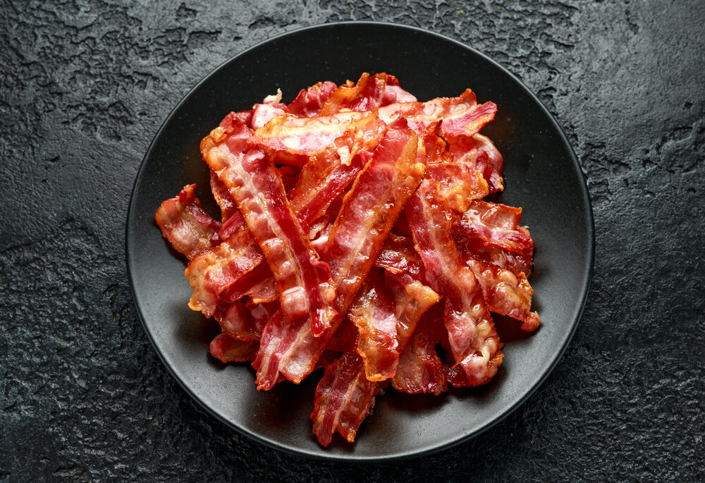 Bowl of cooked bacon.