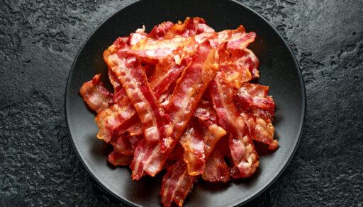 Bowl of cooked bacon.