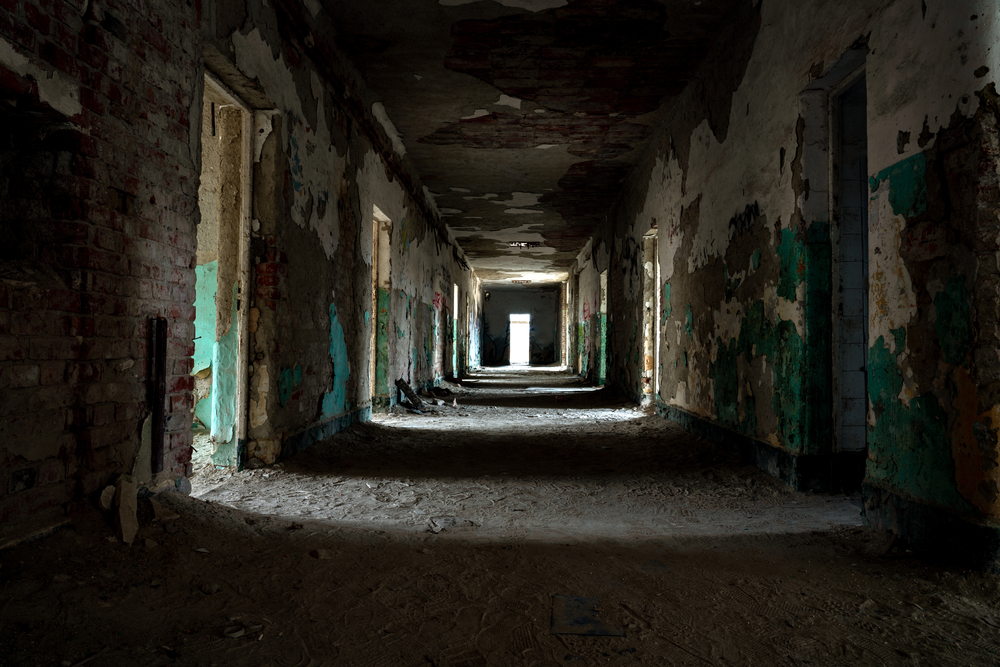 Hallway of an abandoned, decaying building.
