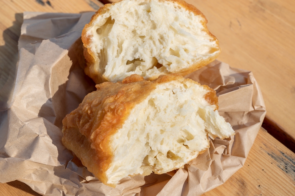 Close-up of traditional bannock bread on paper.