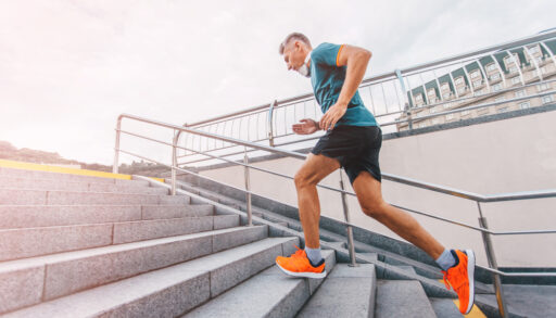Man exercising by running up concrete stairs.