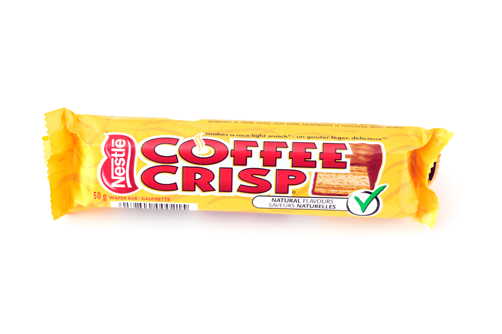 Coffee Crisp chocolate bar on white background. Coffee Crisp is a chocolate bar produced locally in in Canada and it is mostly unavailable in other countries
