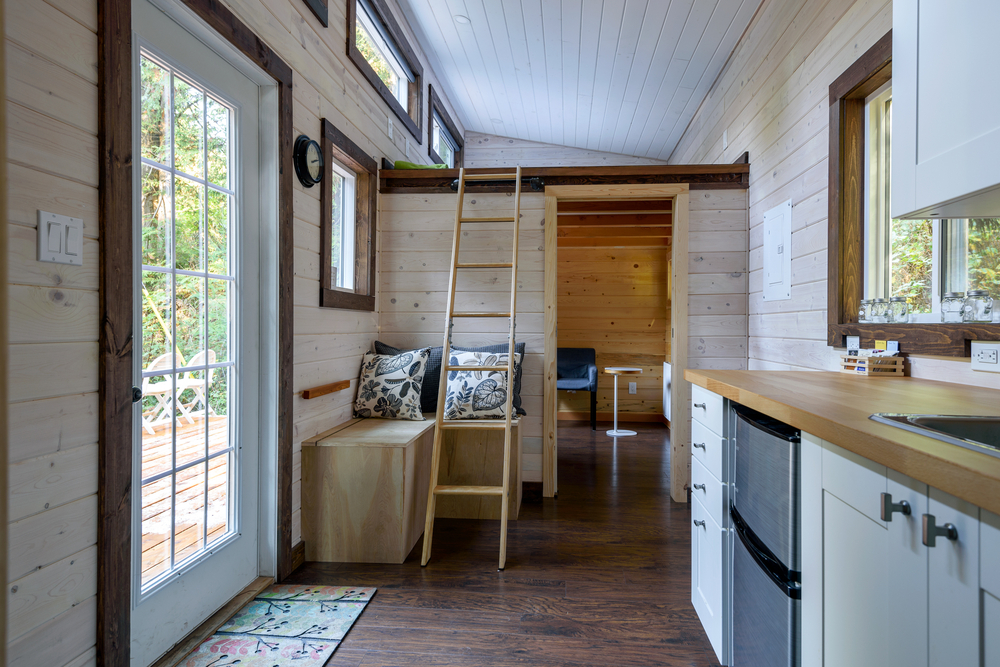 Interior of a tiny house with a loft.