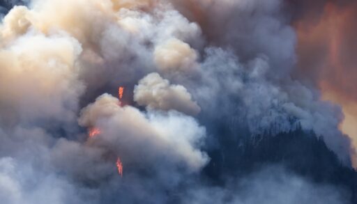 Plumes of smoke from a forest fire near Hope, British Columbia.