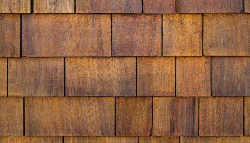 Close-up of cedar shingles installed on an exterior wall.