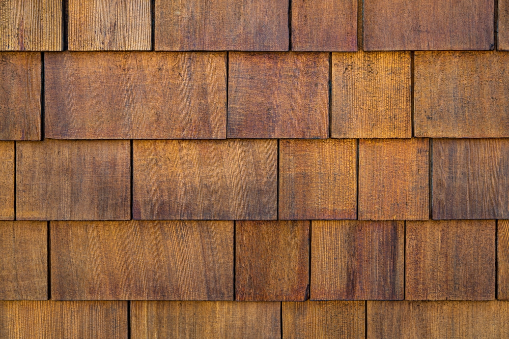 Close-up of cedar shingles installed on an exterior wall.
